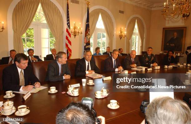 President George W Bush meets with his National Security Advisors in the White House's Cabinet Room, Washington DC, September 12, 2001. They were...