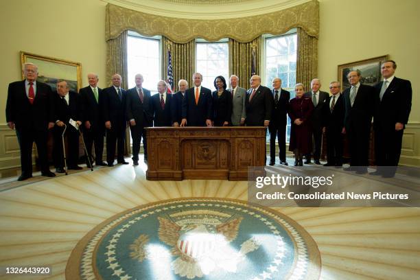 President George W Bush and Secretary of State Condoleezza Rice pose for a photograph with present and former Secretaries of State and Defense in the...