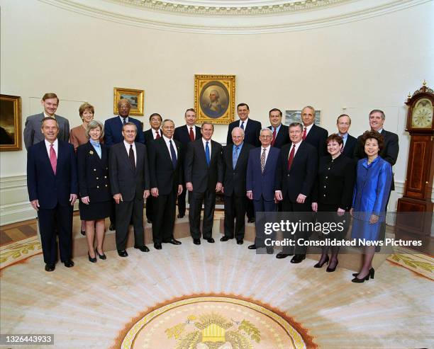 Portrait of US President George W Bush and members of his cabinet as they poses in the White House's Oval Office, Washington DC, April 9, 2001....