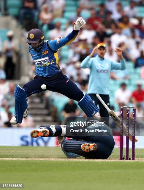 Dhananjaya de Silva of Sri Lanka collides with Jonny Bairstow of England while running between wickets during the 2nd One Day International match...