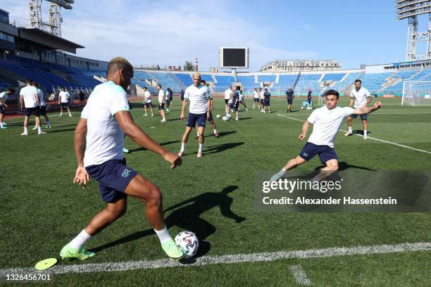 Manuel Akanji and Xherdan Shaqiri of Switzerland train during the Switzerland Training Session ahead of the UEFA Euro 2020 Quarter Final match...