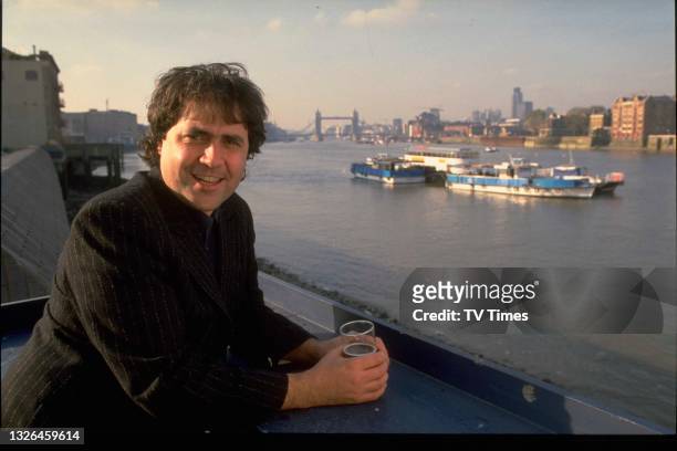 Radio and television presenter Danny Baker photographed by the River Thames in London, circa 1988.