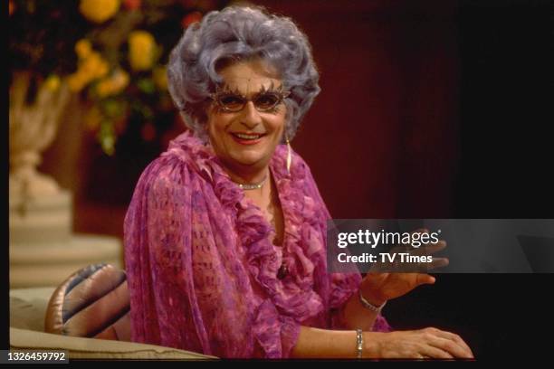 Comic performer Barry Humphries in character as his alter ego Dame Edna Everage in the television special An Audience With Dame Edna Everage, circa...