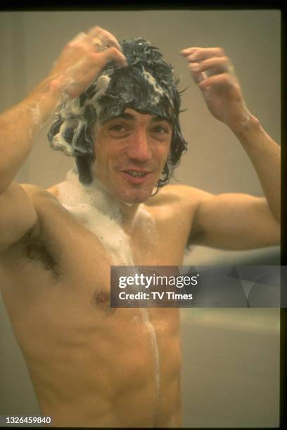 Professional footballer Kevin Keegan in the showers after a Liverpool versus Everton match, circa 1975.