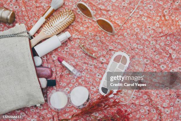 top view makeup bag with beauty items around - beauty case stockfoto's en -beelden