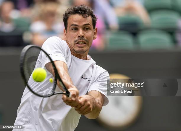 Alex Bolt of Australia plays a backhand during his men's singles second round match against Cameron Norrie of Great Britain during Day Four of The...