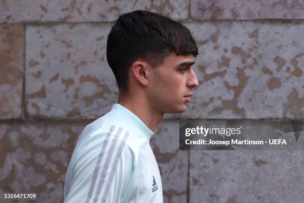 Pedri of Spain makes their way towards the pitch prior to the Spain Training Session ahead of the UEFA Euro 2020 Quarter Final match between Spain...