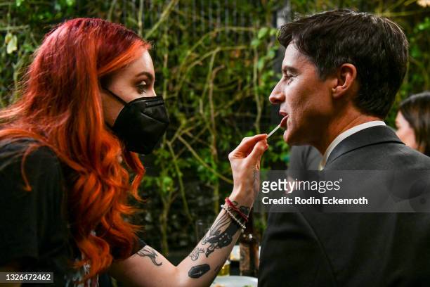 Angie Shell touches up actor Charlie Farrell's makeup during production of the indie feature film, “The Star City Murders” on July 01, 2021 in Los...