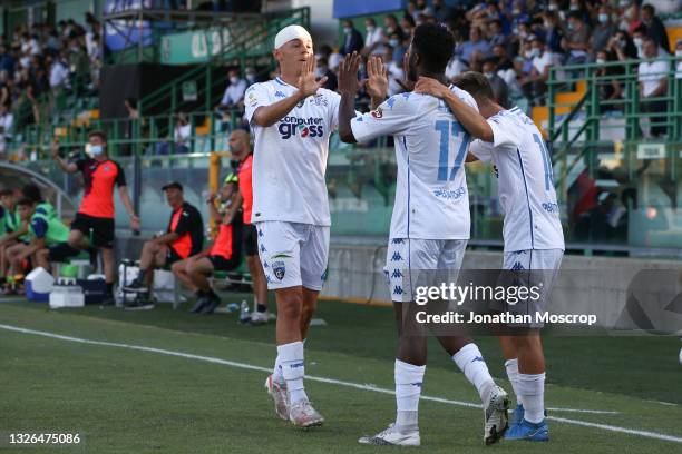 Emmanuel Ekong of Empoli FC celebrates with team mates Kristjan Asllani and Tommaso Baldanzi after scoring to give the side a 4-2 lead during the...