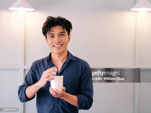 man alone with coffee - malay archipelago stock pictures, royalty-free photos & images