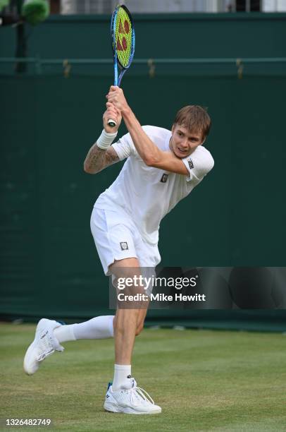 Alexander Bublik of Kazakhstan plays a backhand during his men's singles second round match against Grigor Dimitrov of Bulgaria during Day Four of...