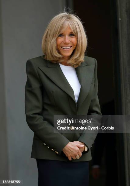 French first lady Brigitte Macron poses as she receives the UN Special Representative On Sexual Violence In Conflict at the Elysee Palace on July 1,...