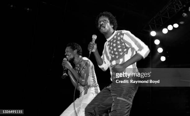 Singers and musicians Charlie and Ronnie Wilson of The Gap Band performs at the U.I.C. Pavilion in Chicago, Illinois in January 1983.
