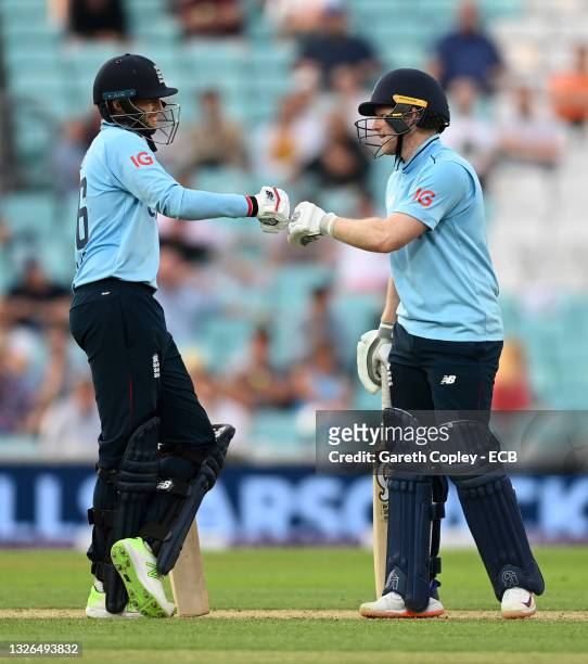 England captain Eoin Morgan and Joe Root shake hands during the second One Day International between England and Sri Lanka at The Kia Oval on July...