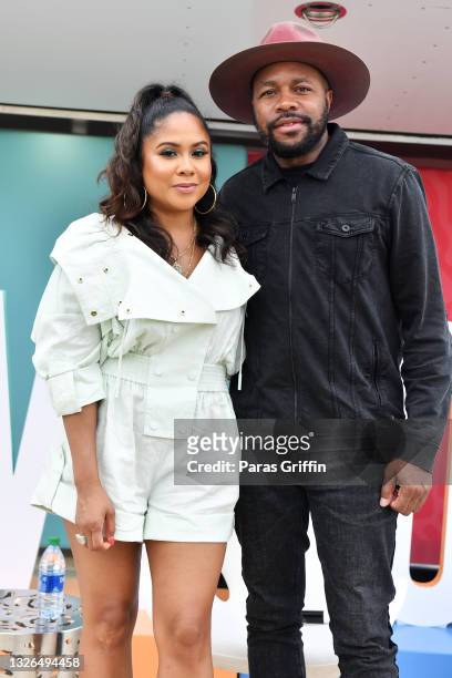 In this image released on July 1, Angela Yee and D-Nice pose onstage at the 2021 ESSENCE Festival Of Culture presented by Coca-Cola in New Orleans,...