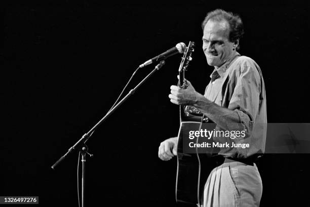 Singer-songwriter-guitarist James Taylor performs at McNichols Sports Arena on September 29, 1986 in Denver, Colorado. He was born in Boston,...