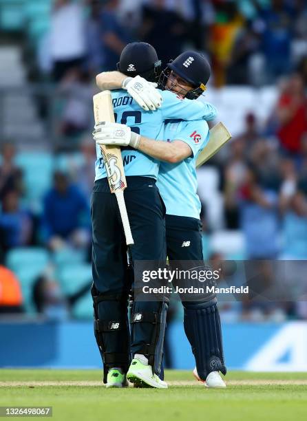 Eoin Morgan and Joe Root of England celebrate hitting the final runs for victory during the 2nd One Day International match between England and Sri...