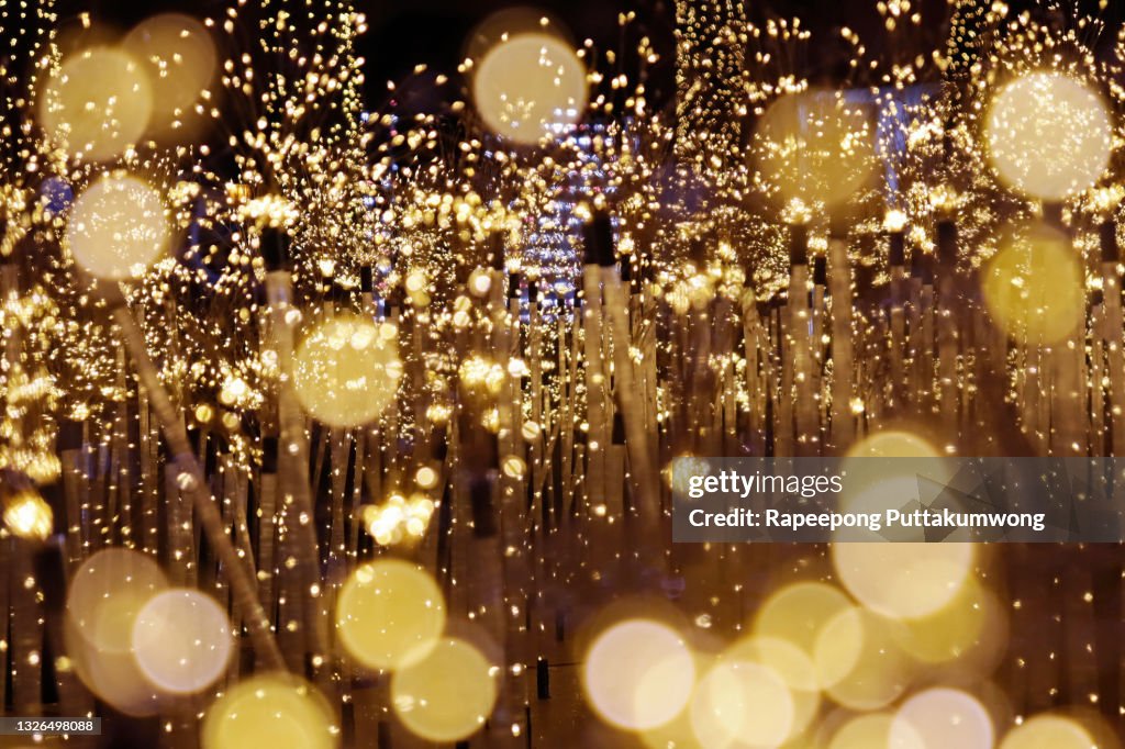 Gold sparkling background bokeh. Elegant gold background with glitter sparkle bokeh