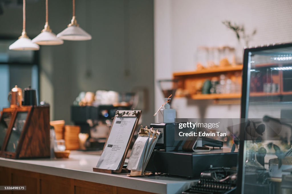 Interior of cozy café coffee shop small business at counter artisanal food and drink establishment