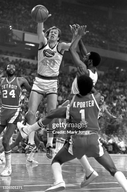 Denver Nuggets forward Byron Beck goes up for a rebound over teammate Ted McClain during an NBA basketball game against the Detroit Pistons at...