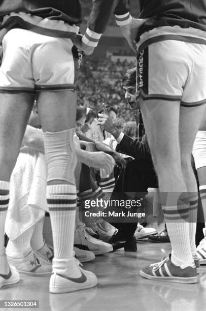 Denver Nuggets Head Coach Larry Brown gives instructions to his team during a timeout in an NBA basketball game against the Detroit Pistons at...