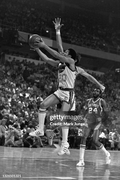 Denver Nuggets guard Mack Calvin makes a driving layup towards the basket during an NBA basketball game against the Detroit Pistons at McNichols...