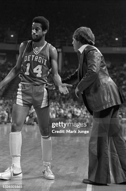 Detroit Pistons Head Coach Herb Brown pushes and advises guard Eric Money during an NBA basketball game against the Denver Nuggets at McNichols Arena...