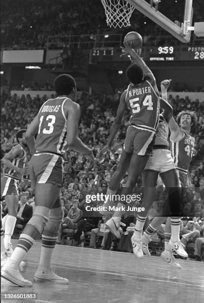 Detroit Pistons forward Howard Porter blocks a shot by Denver Nuggets forward Paul Silas during an NBA basketball game against the Detroit Pistons at...