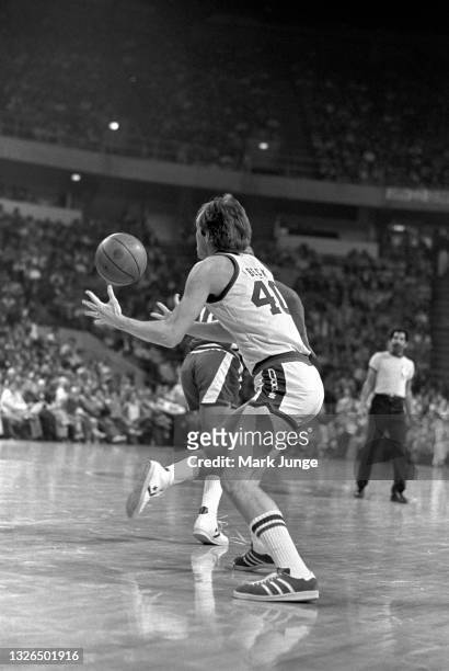 Denver Nuggets forward Byron Beck passes the ball to a teammate during an NBA basketball game against the Detroit Pistons at McNichols Arena on March...