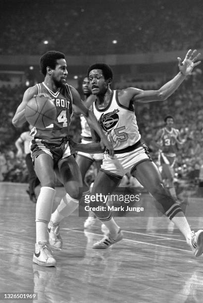 Denver Nuggets guard Jim Price tries to block a dribbling Detroit Piston guard Eric Money during an NBA basketball game at McNichols Arena on March...