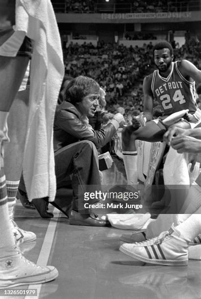Detroit Pistons Head Coach Herb Brown kneels in front of his players during a timeout in an NBA basketball game against the Denver Nuggets at...