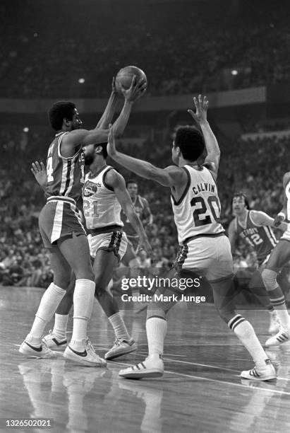 Denver Nuggets guard Mack Calvin plays defense against Detroit Pistons guard Eric Money during an NBA basketball game against the Denver Nuggets at...