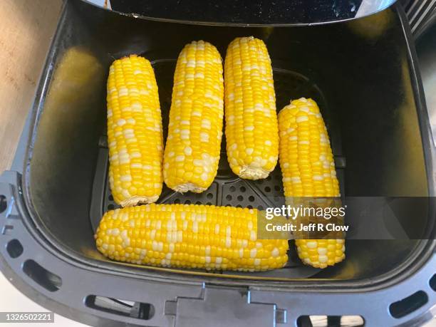 fresh sweet corn preparation in iowa usa - airfryer stock pictures, royalty-free photos & images