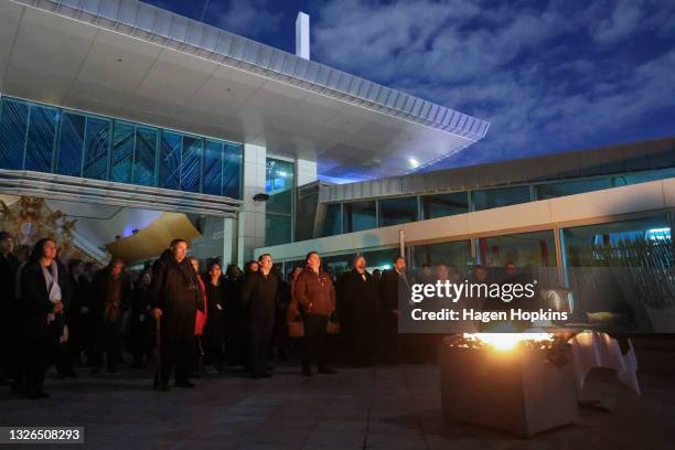 Guests look on during a dawn ceremony at Rongomaraeroa, Te Papa Museum, on July 02, 2021 in Wellington, New Zealand. Minister for Workplace Relations...