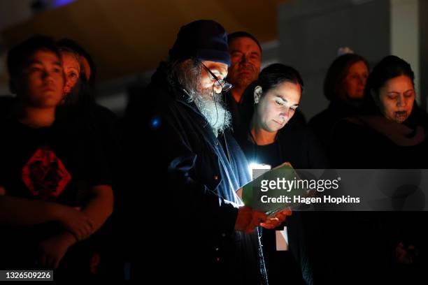 Guests look on during a dawn ceremony at Rongomaraeroa, Te Papa Museum, on July 02, 2021 in Wellington, New Zealand. Minister for Workplace Relations...