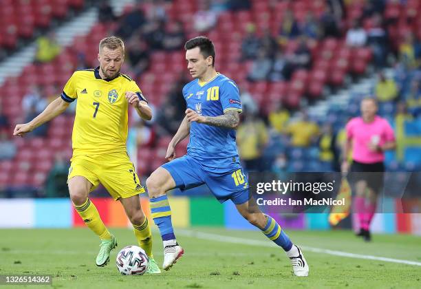 Sebastian Larsson of Sweden vies with Mykola Shaperenko of Ukraine during the UEFA Euro 2020 Championship Round of 16 match between Sweden and...