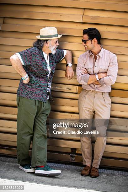Gianni Fontana, wearing green pants, white t-shirt and multicolor shirt and Frank Gallucci, wearing beige pants and shirt, are seen at Fortezza Da...