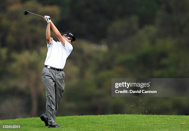 Nick O'Hern of Australia plays his second shot on the par 5, 17th hole during day four of the 2011 Emirates Australian Open at The Lakes Golf Club on...