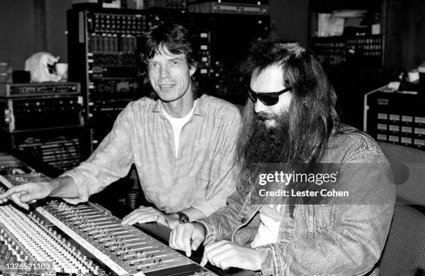 English singer, songwriter, actor, and film producer Mick Jagger sits with American record producer and founder of Def American Recordings Rick Rubin...