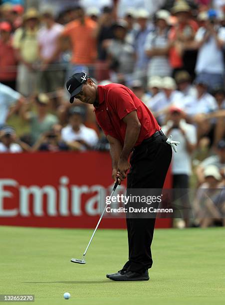 Tiger Woods of the USA putts on the par 3, 9th hole during day four of the 2011 Emirates Australian Open at The Lakes Golf Club on November 13, 2011...