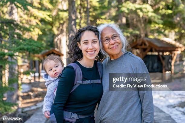 happy multi-generation family enjoying nature hike - beautiful granny 個照片及圖片檔