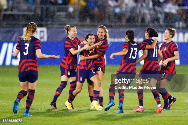Tobin Heath of United States celebrates with teammates after scoring a goal against Mexico at Rentschler Field on July 01, 2021 in East Hartford,...