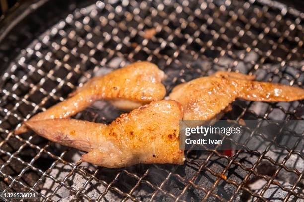 japanese hibachi style grill cuisine, bbq chicken wings - chicken thigh stock-fotos und bilder