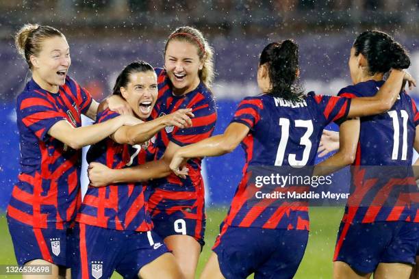 Tobin Heath of United States celebrates with Christen Press, Alex Morgan, Lindsey Horan and Emily Sonnett, #14 after scoring a goal against Mexico at...