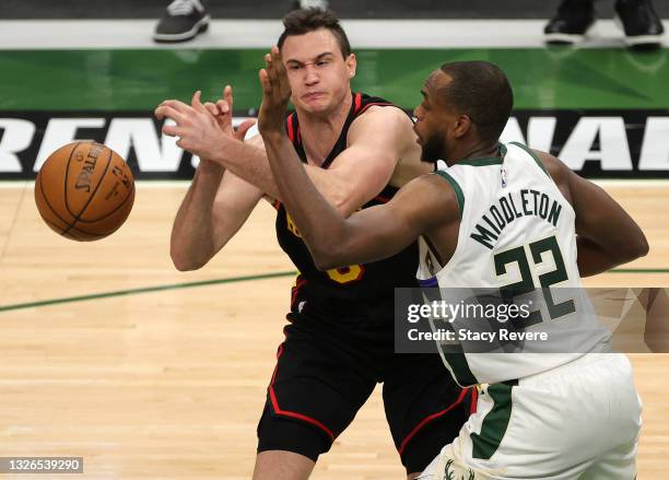 Danilo Gallinari of the Atlanta Hawks is fouled by Khris Middleton of the Milwaukee Bucks during the second half in Game Five of the Eastern...