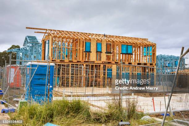 new houses timber construction frame, overcast sky,  housing development - concrete block stock pictures, royalty-free photos & images