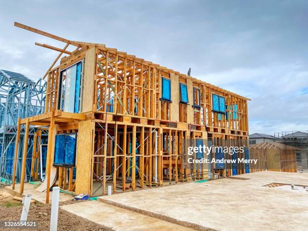 new house construction, timber frame and concrete block - housing problems stock pictures, royalty-free photos & images