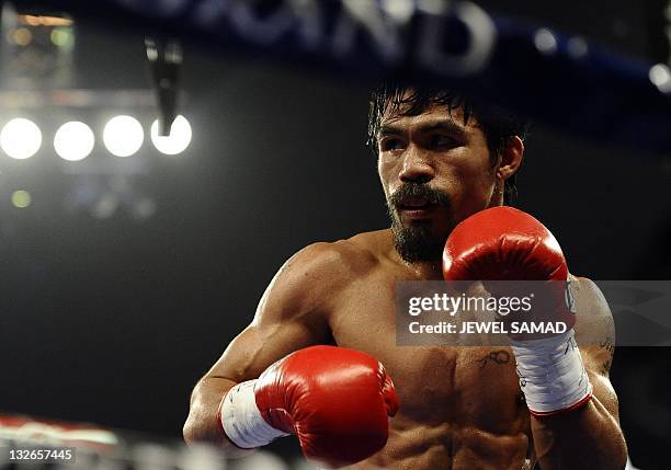 Manny Pacquiao of the Philippines fights Juan Manuel Marquez of Mexico for the WBO Welter Weight Title at the MGM Grand Garden Arena on November 12,...