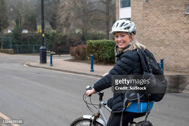 commuting to work on a bike - sports helmet stock pictures, royalty-free photos & images