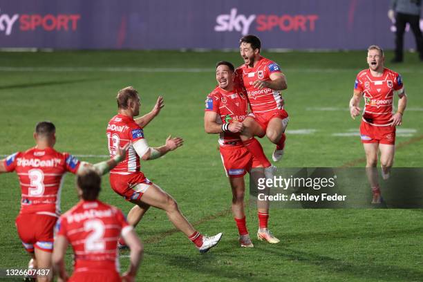 Dragons players celebrate the win from a Golden Point from Corey Norman during the round 16 NRL match between New Zealand Warriors and the St George...